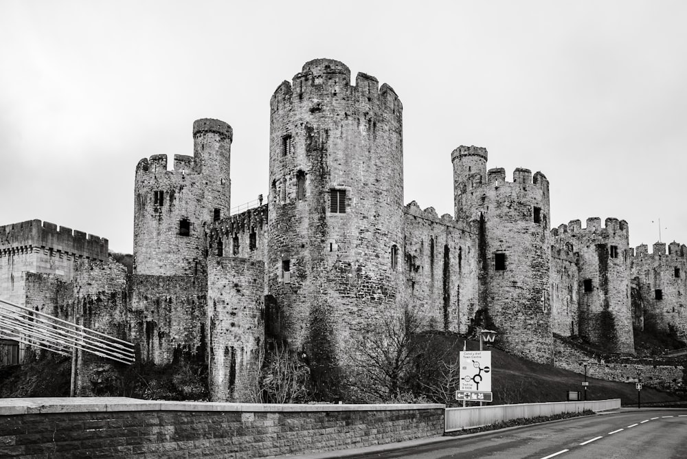 a stone castle with a road