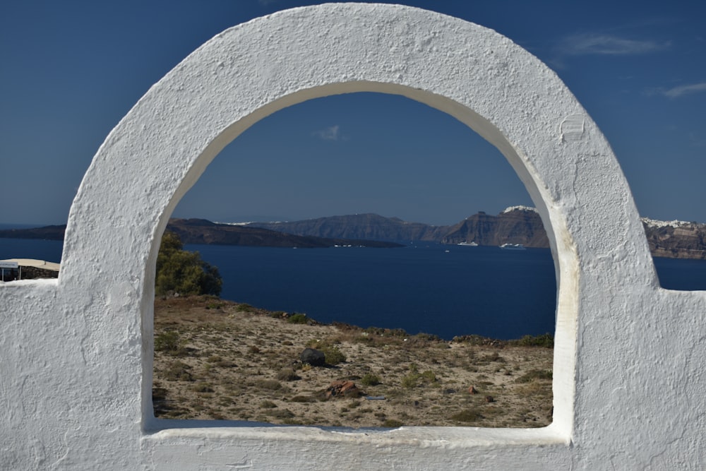 a large stone arch over a body of water