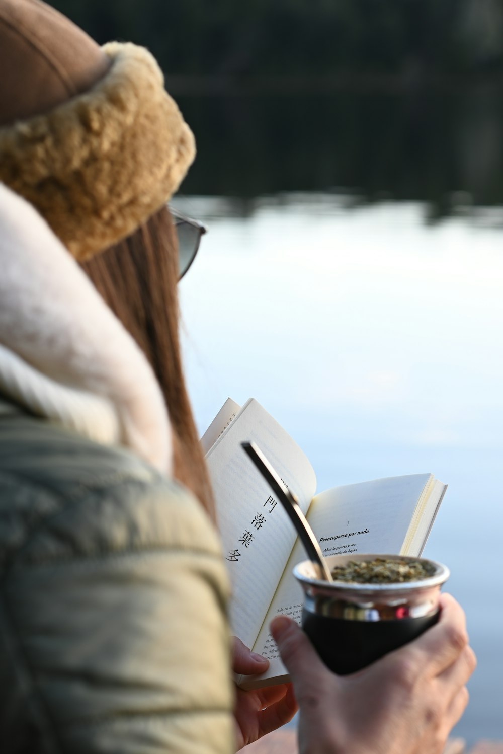 a person holding a cup of coffee