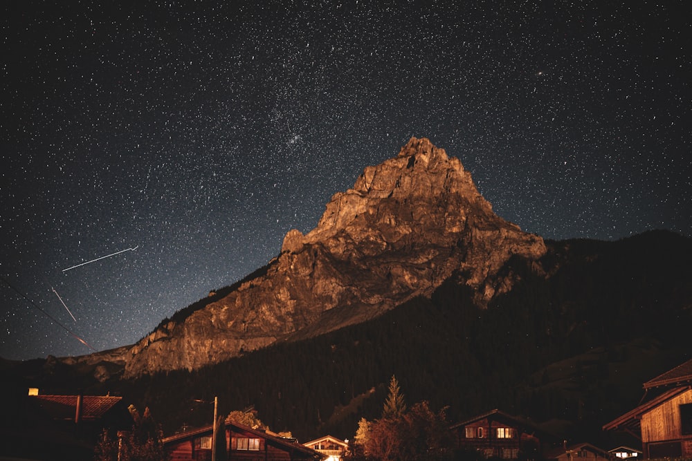 a mountain with a star in the sky