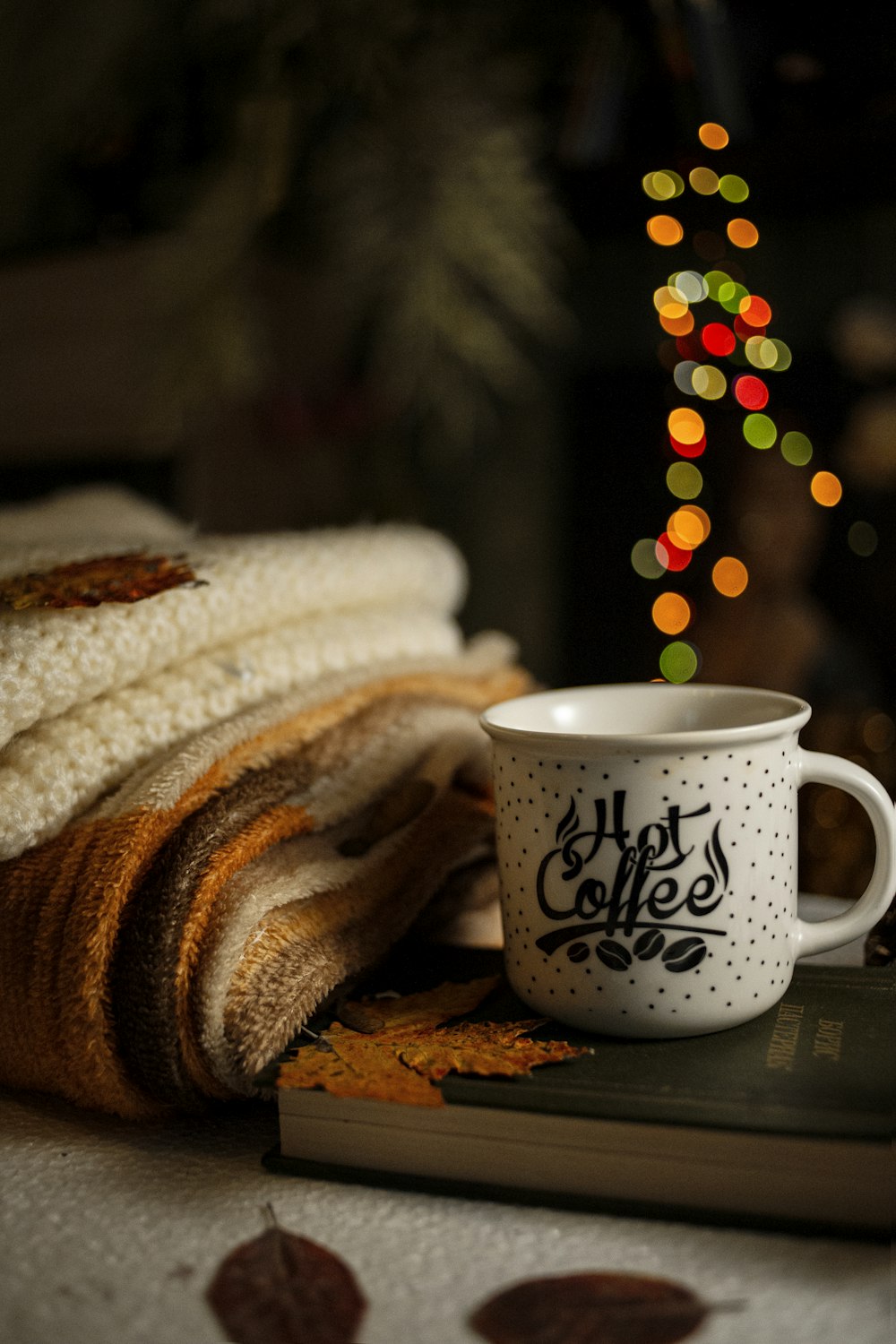 a cup of coffee and a bag of chips on a table