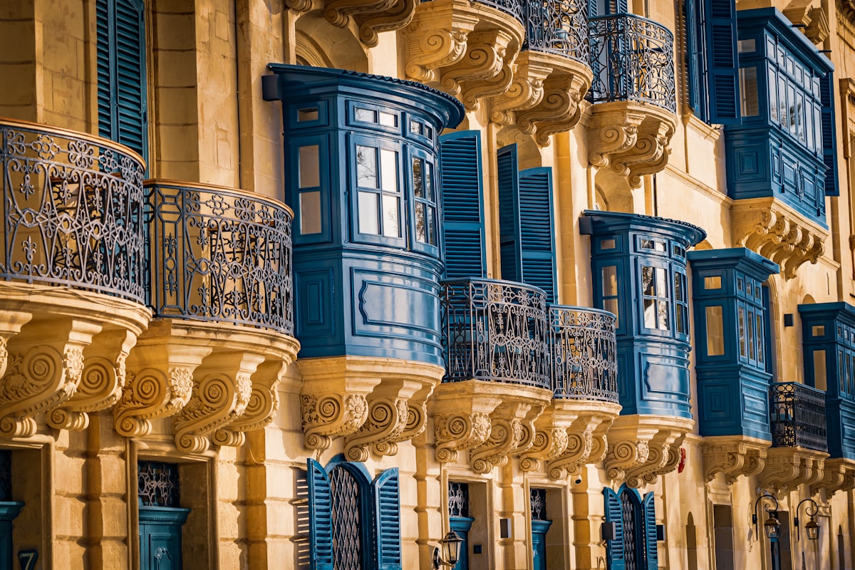 Valletta May — ornate blue enclosed wooden gallarija balconies on Valletta building facades, the city's distinctive architectural signature