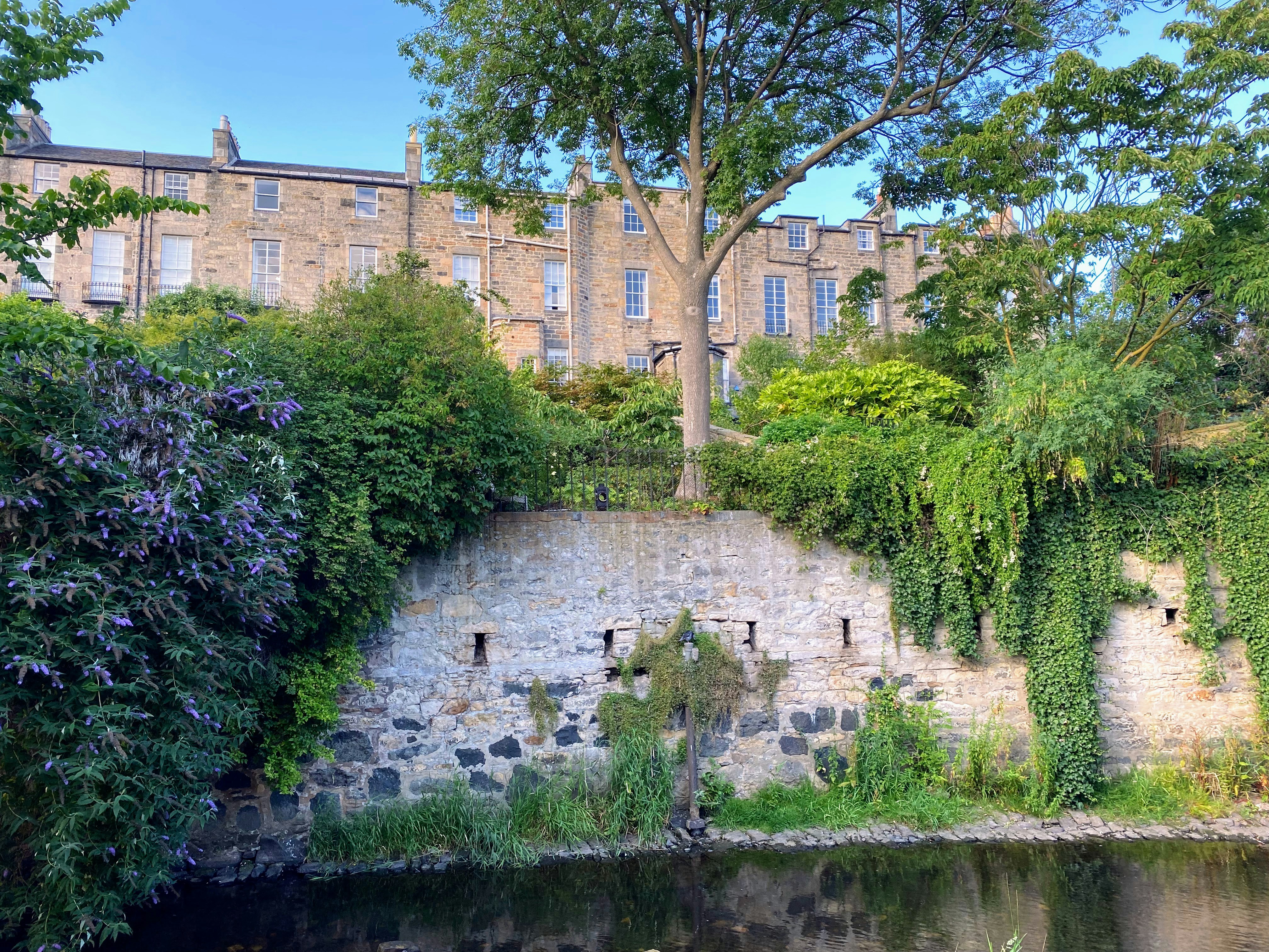 a building with a pond in front of it