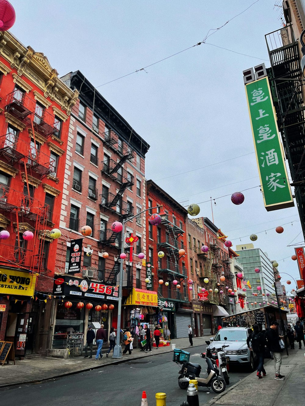 a busy street with buildings and people