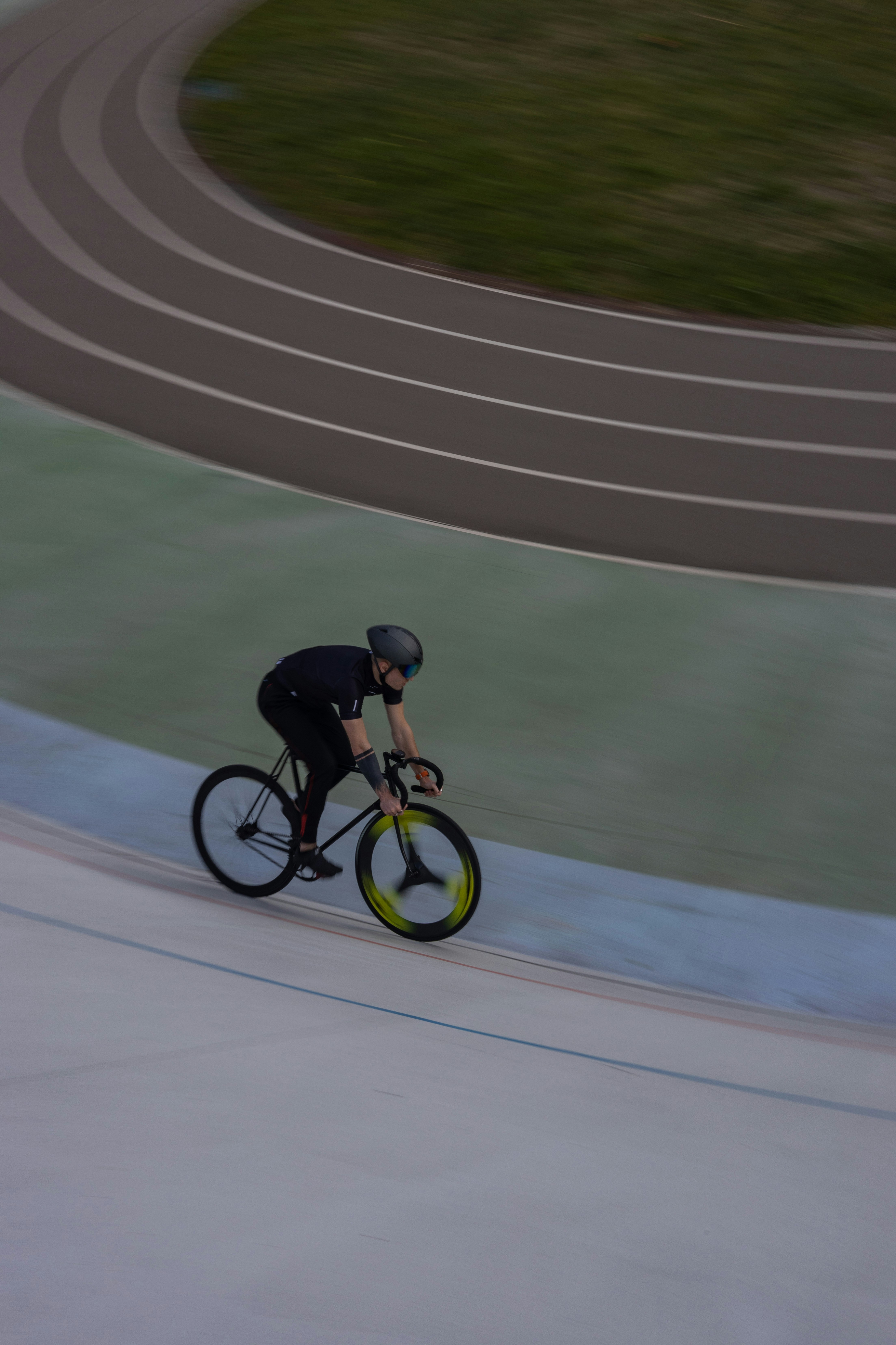 a person riding a bicycle on a track