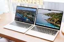 a couple of laptops on a table