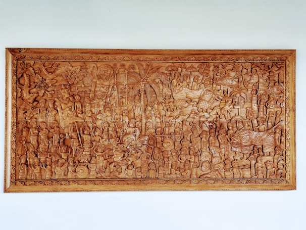 Large wooden mural featuring a detailed nature scene with animals and trees