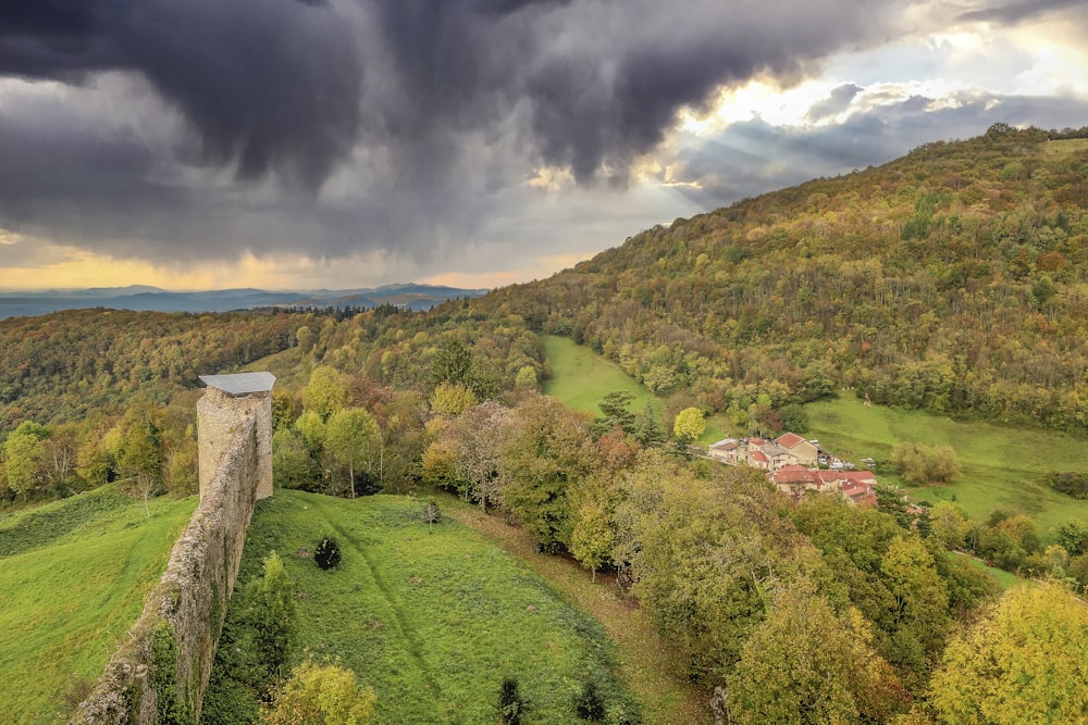 a stone tower in a valley