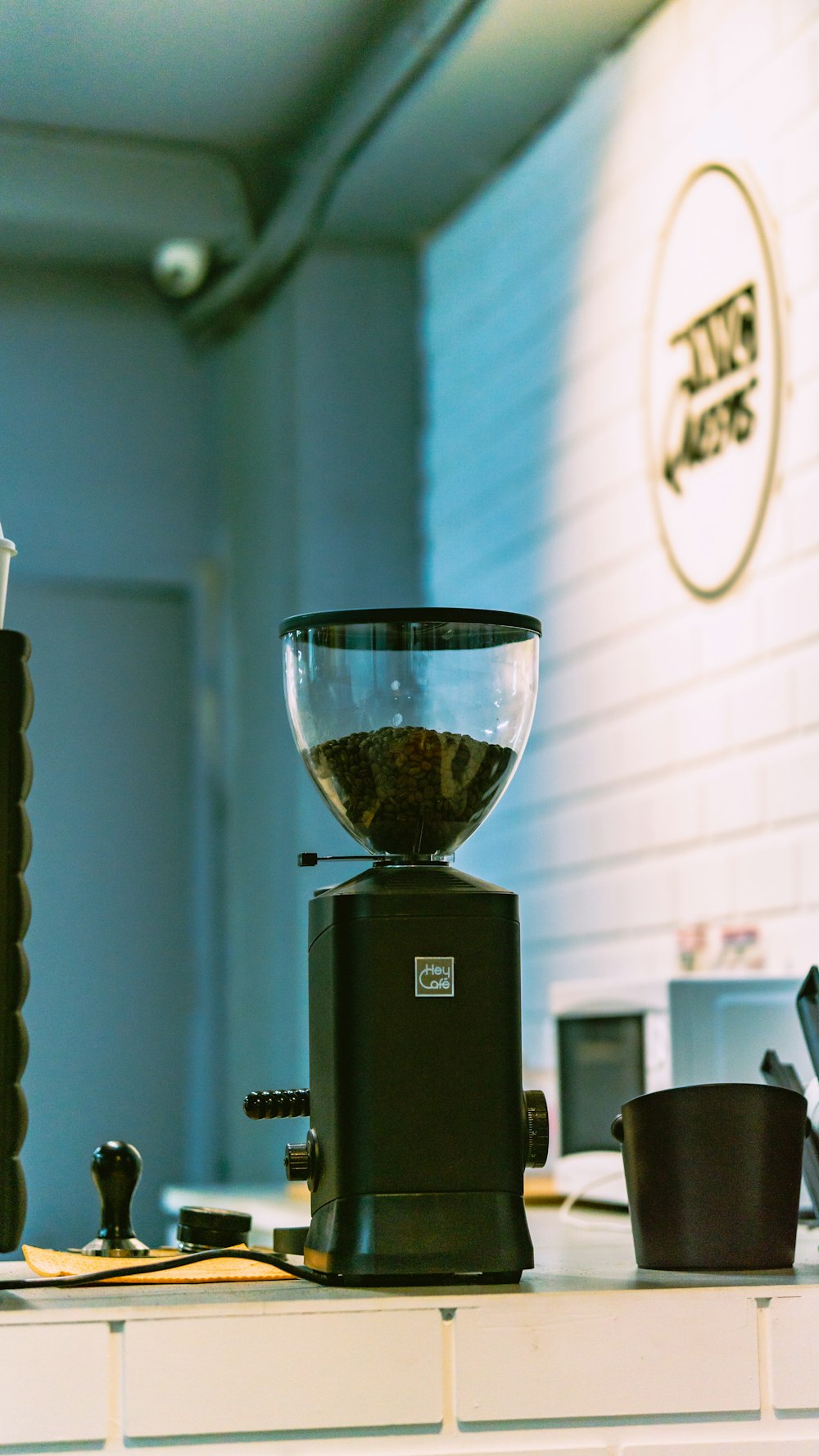 a glass of wine on a coffee maker