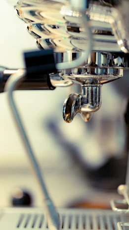 Close-up of high-quality kitchen equipment being serviced by a skilled technician.