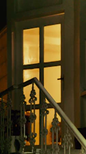 A cozy home entrance with a smart doorbell glowing softly at dusk