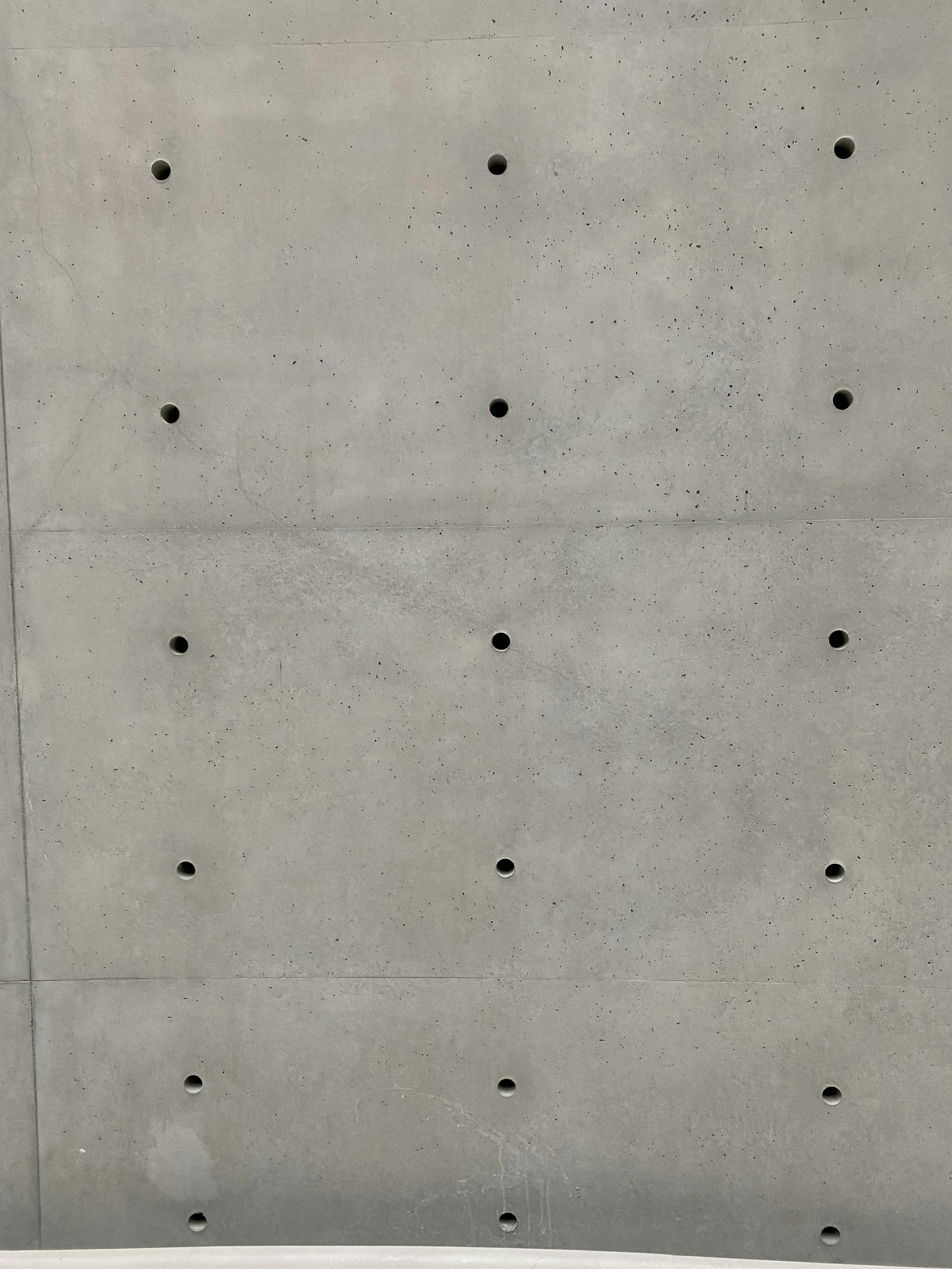 a white surface with black dots