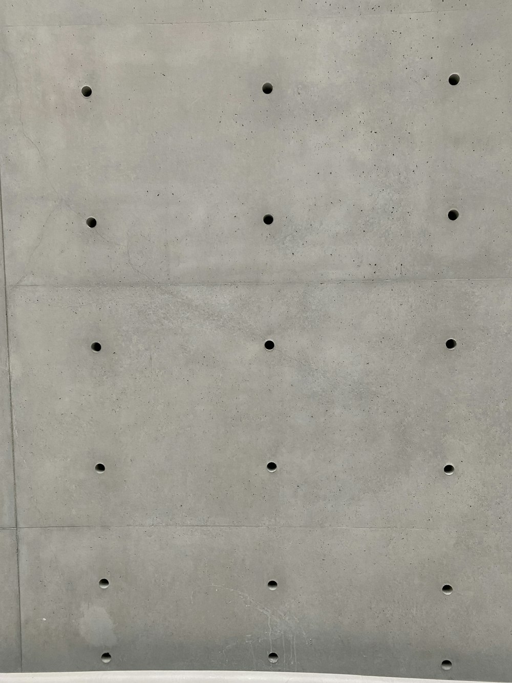 a white surface with black dots