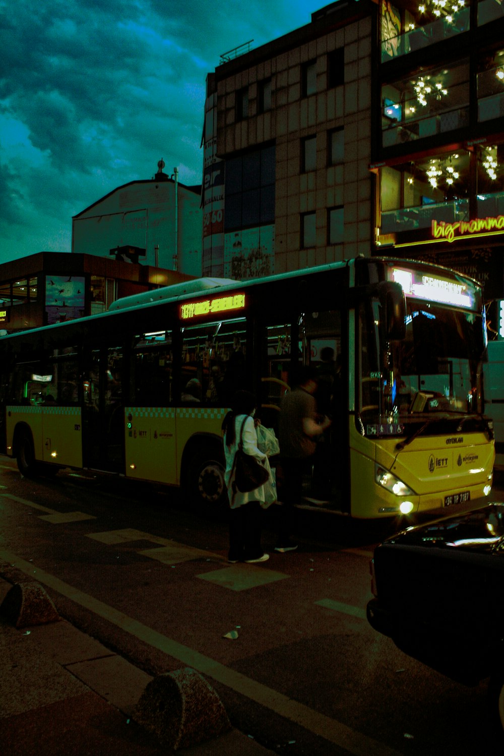 a bus picking up passengers