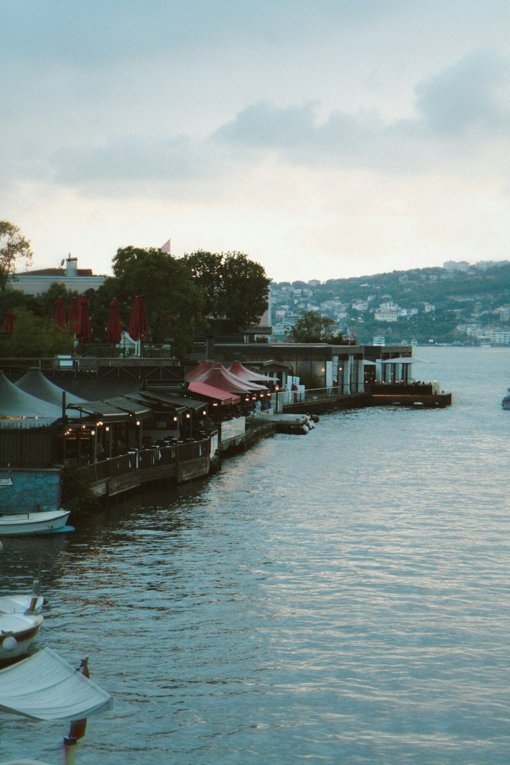 a dock with boats and buildings