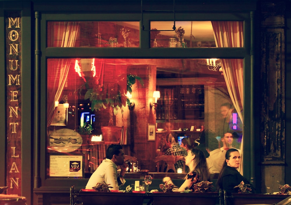 a group of people sitting at a table