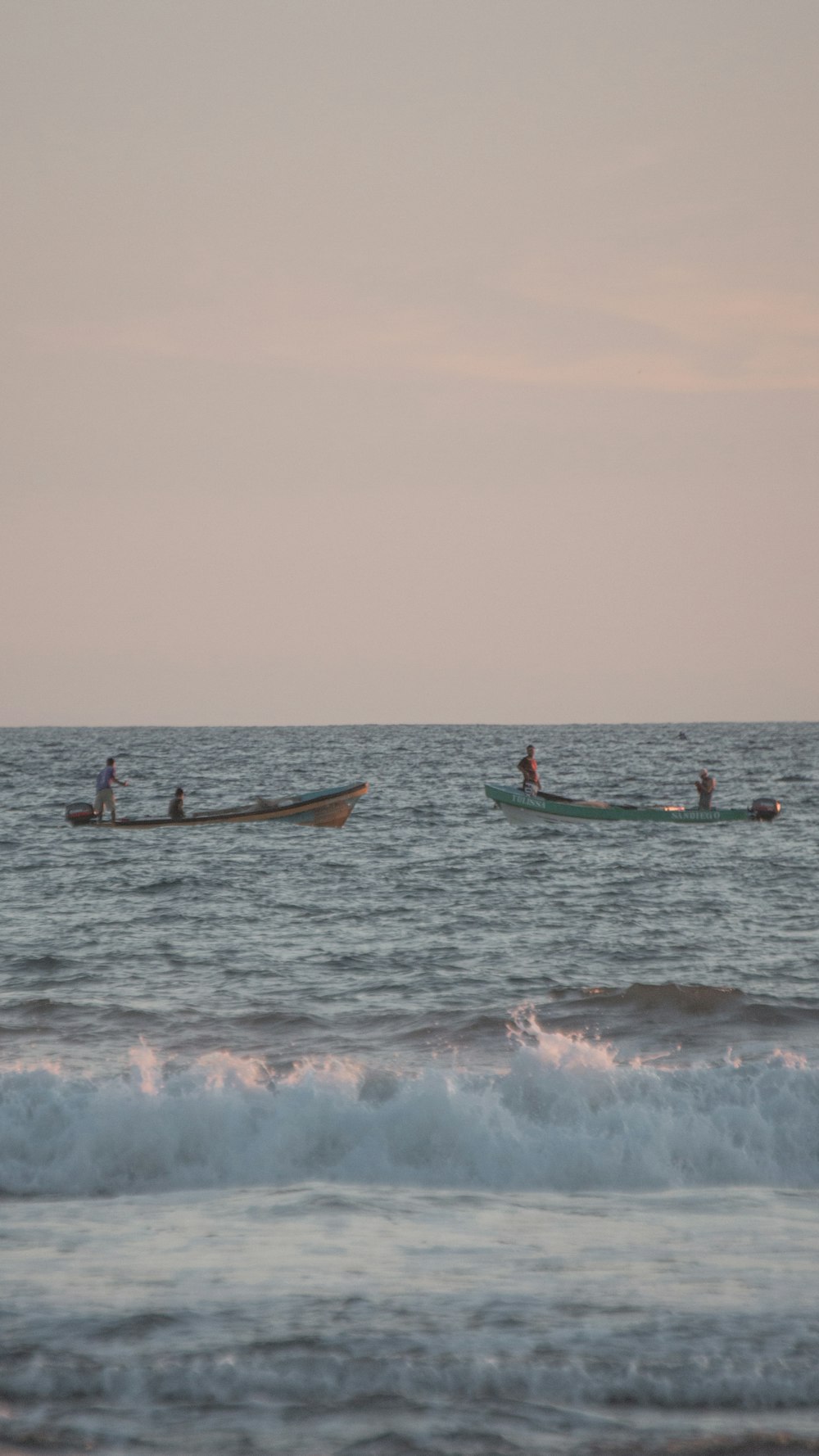 people in boats in the water