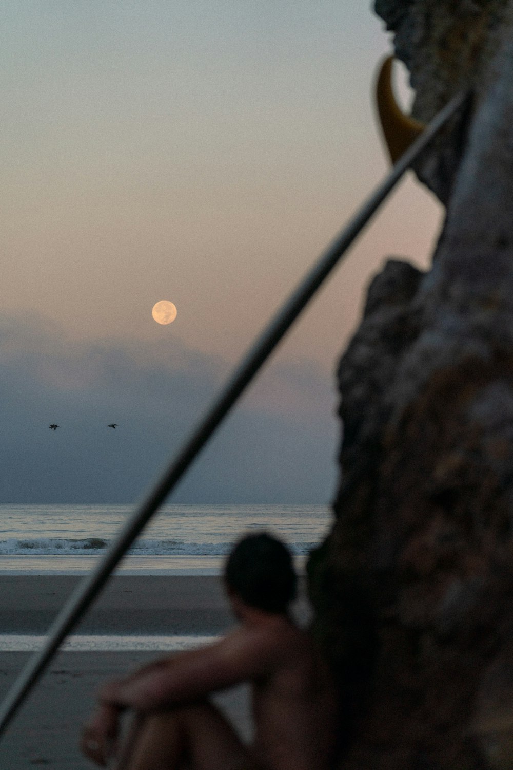 a person sitting on a beach