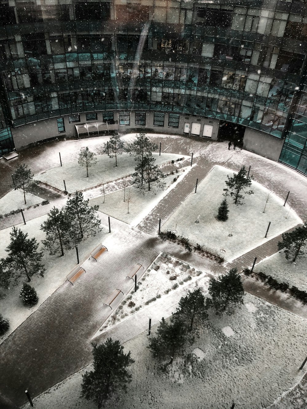 a building with trees and a courtyard