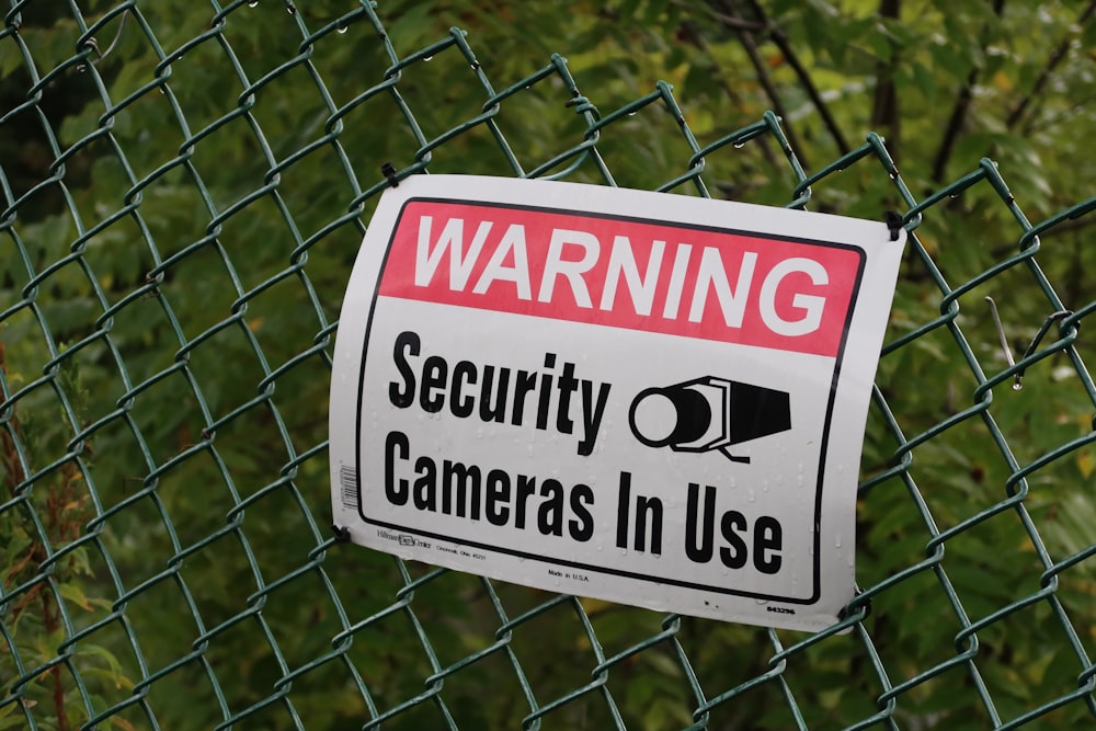 a sign on a fence