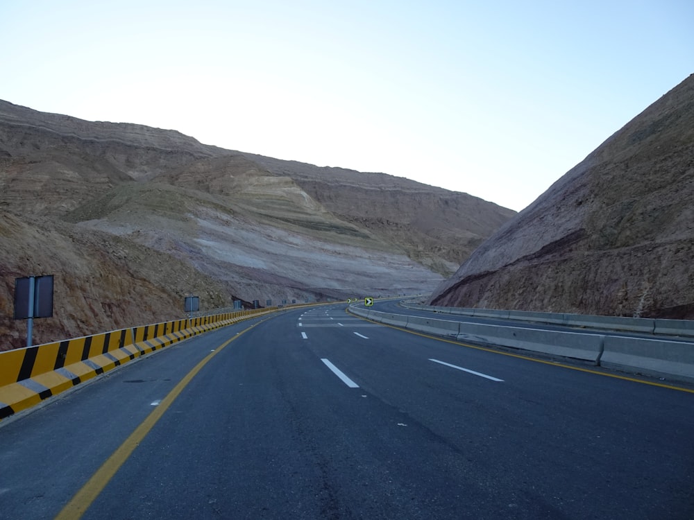 a road with mountains on the side