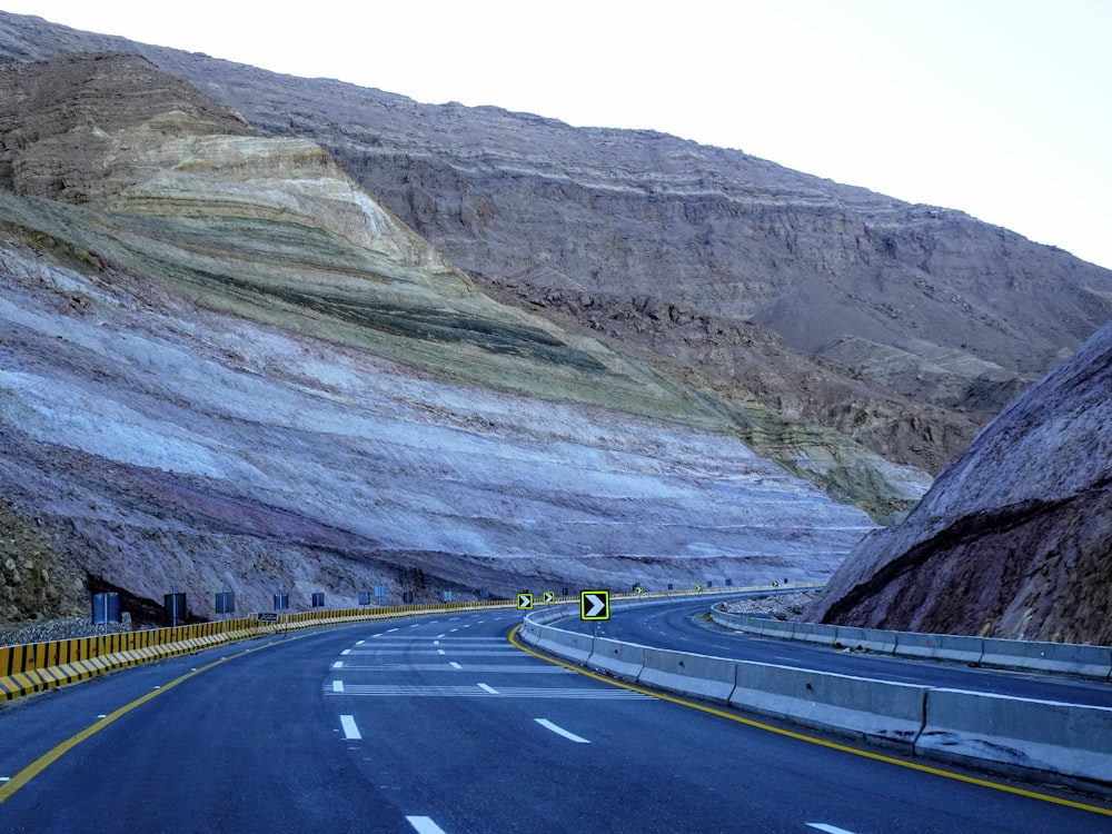 a road with mountains on the side