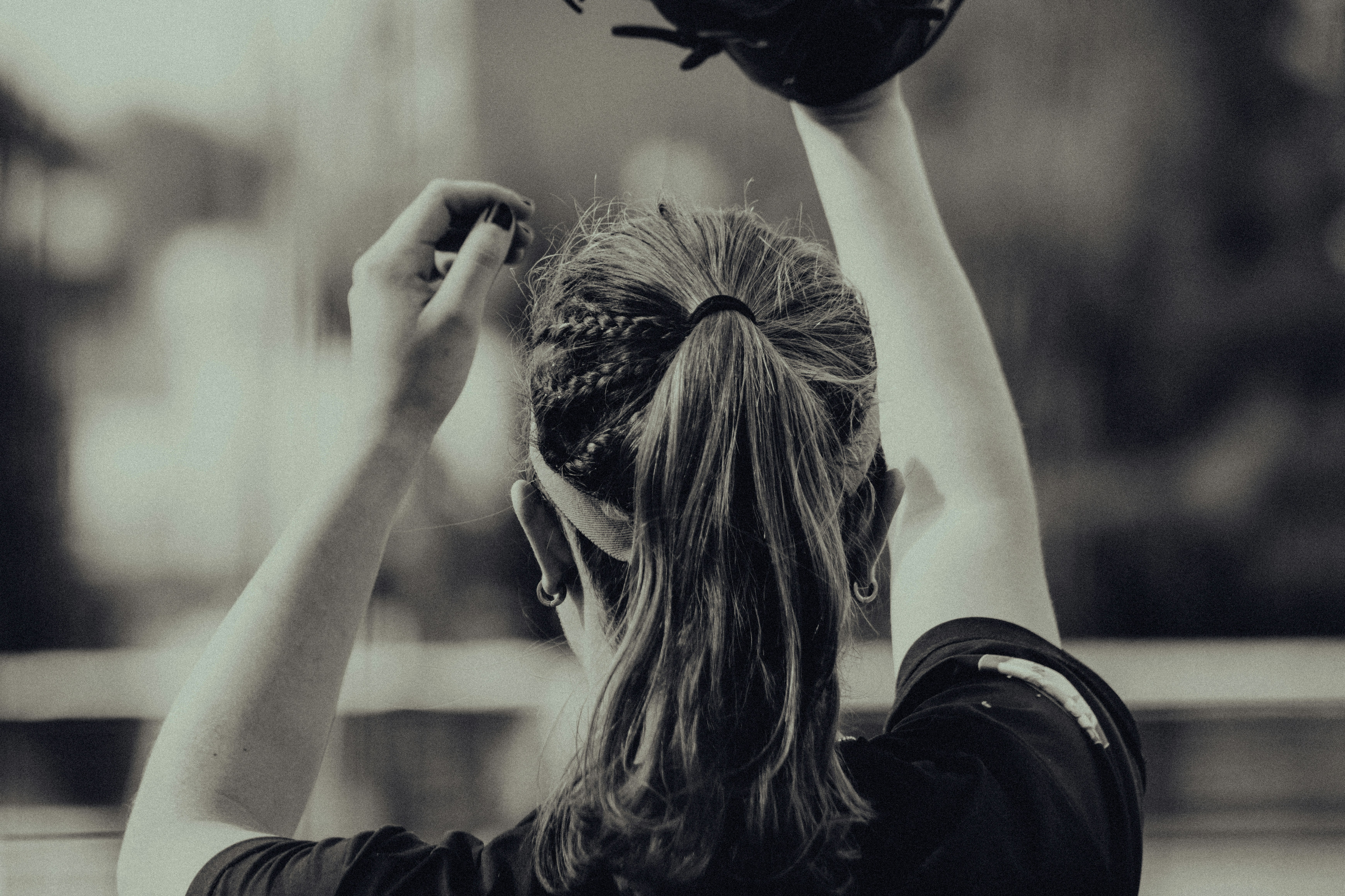a woman with her hair in the air