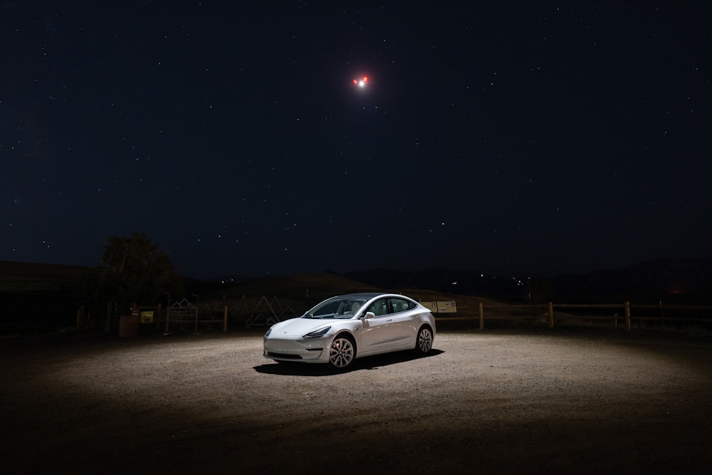 a car parked in a dirt lot