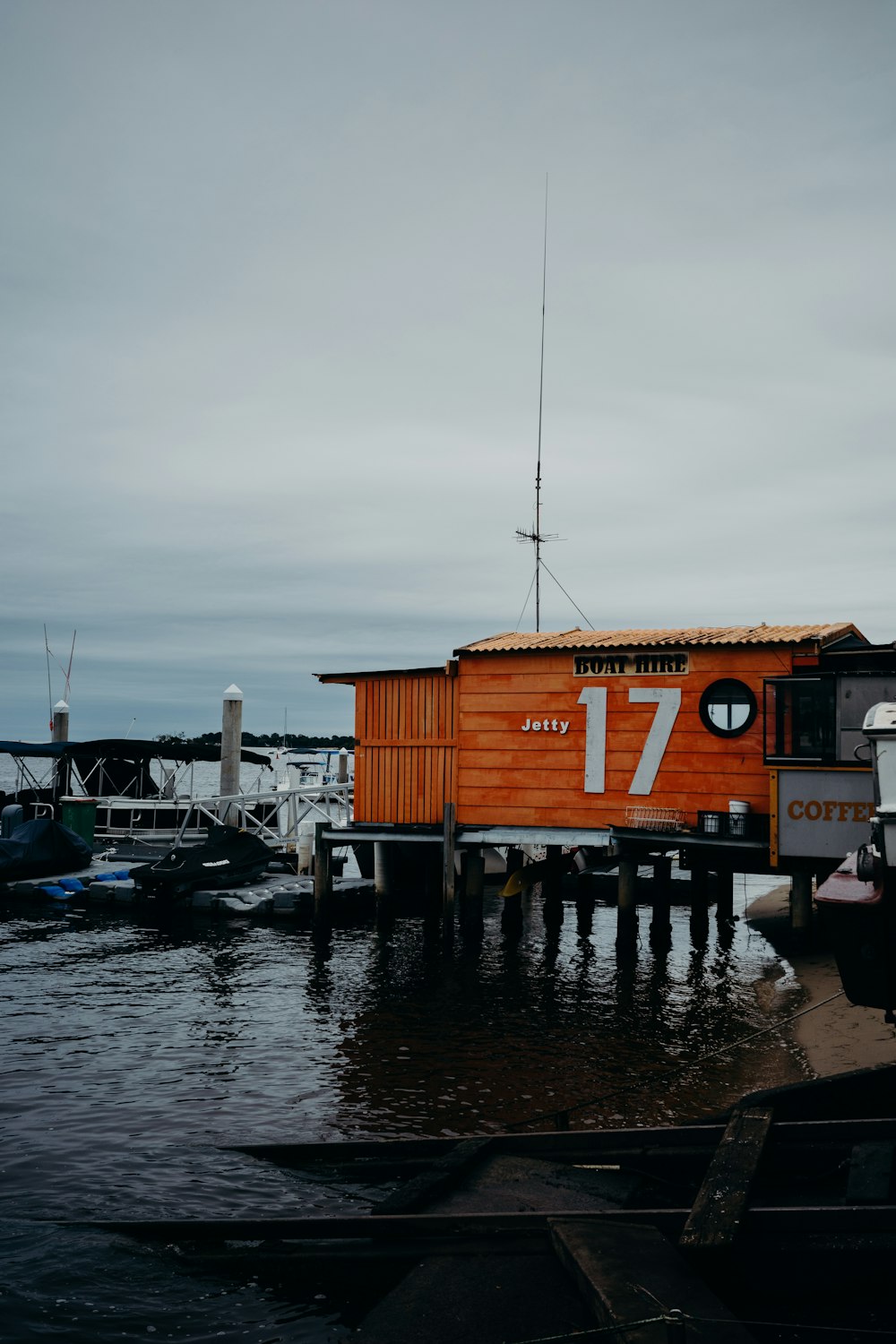 a boat dock with a building on it