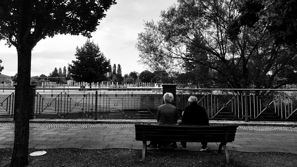 a couple sitting on a bench