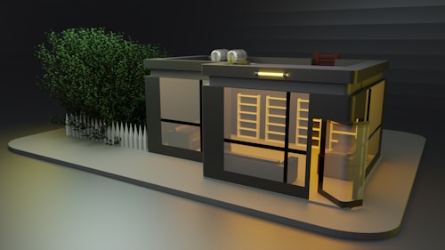 A modern, glass-walled building is illuminated with warm light, set against a dark background. There is a rooftop garden with plants and a chair. A white picket fence surrounds the structure on one side, and lush greenery is visible behind the fence. The overall design is sleek and minimalist.