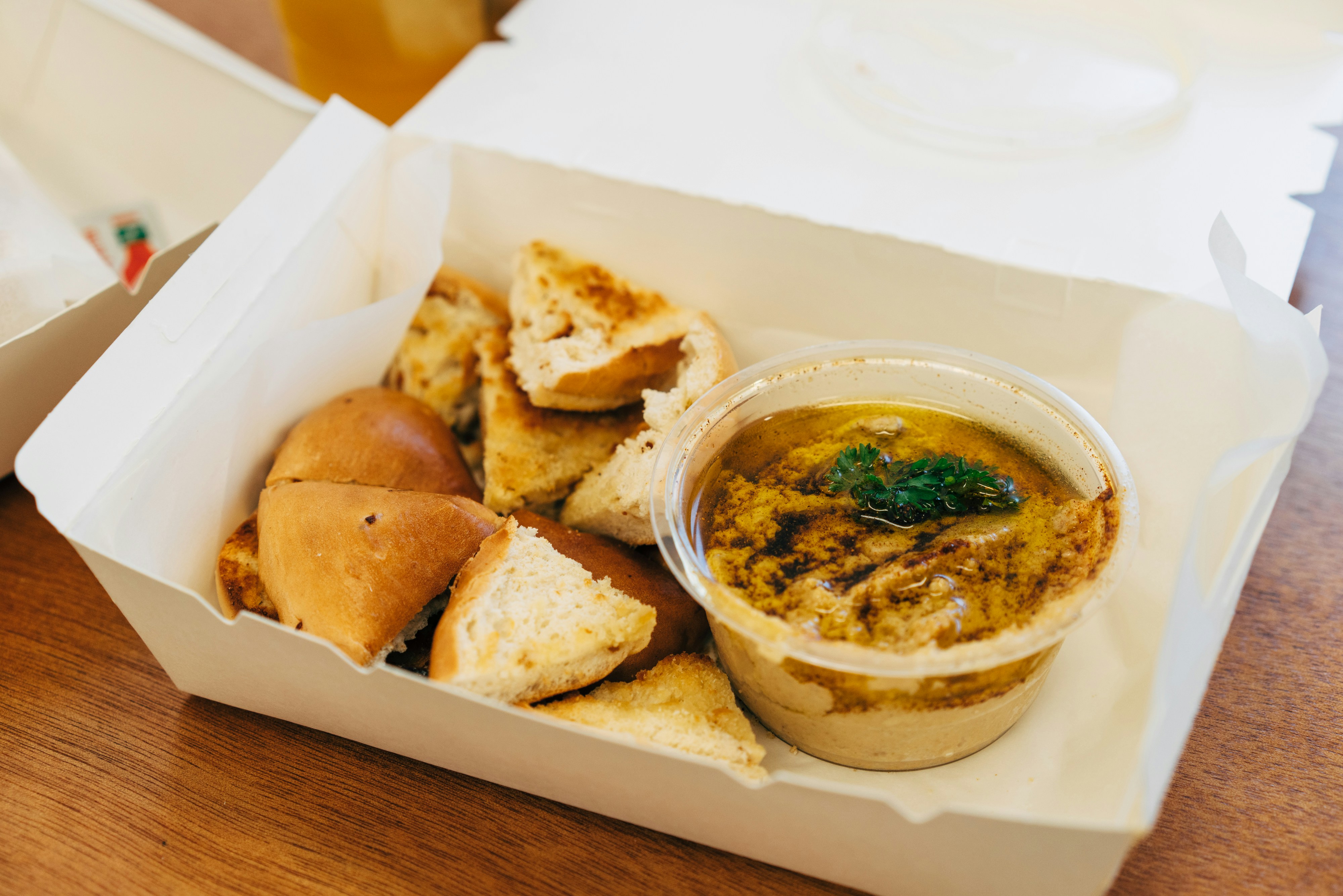 Takeaway box with bread and dip