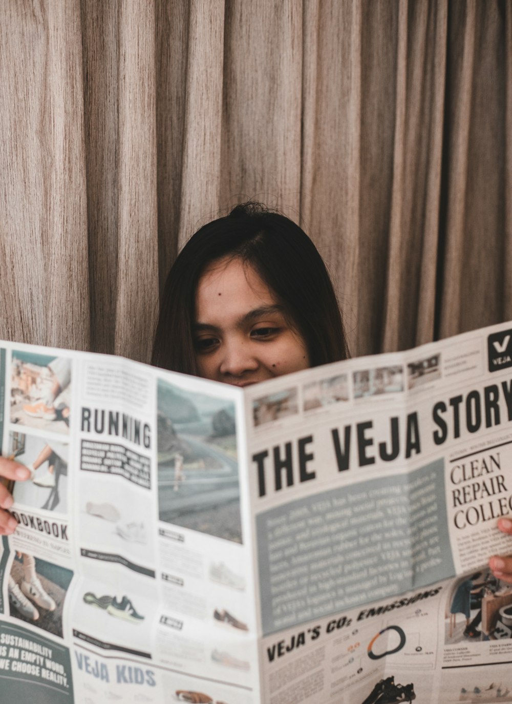 a person holding a newspaper