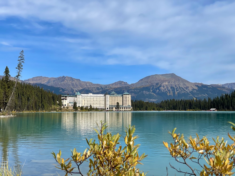 a body of water with a building in the background