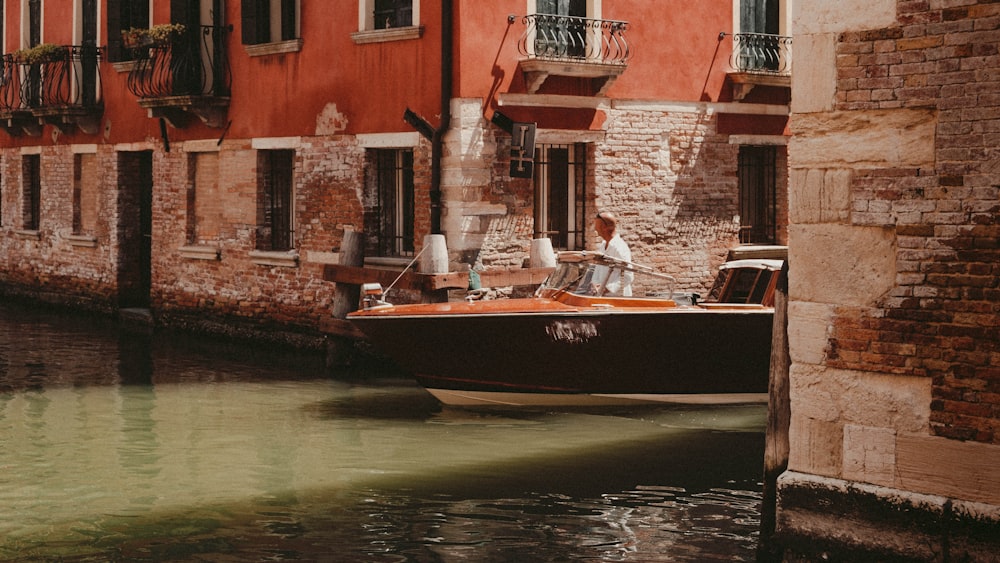 a person on a boat in a canal