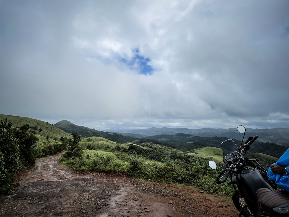 a motorcycle parked on a dirt road