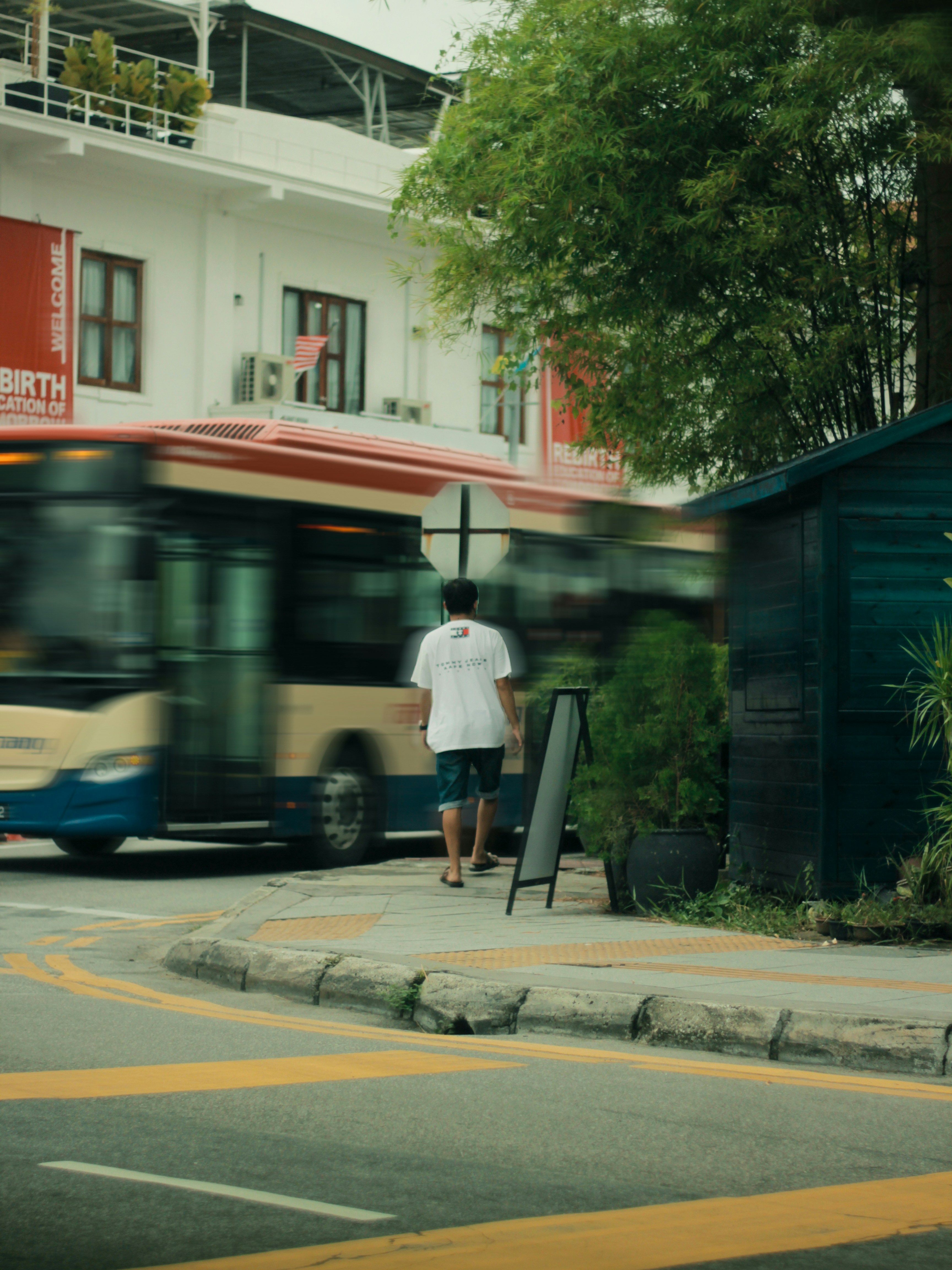 a person standing on the sidewalk