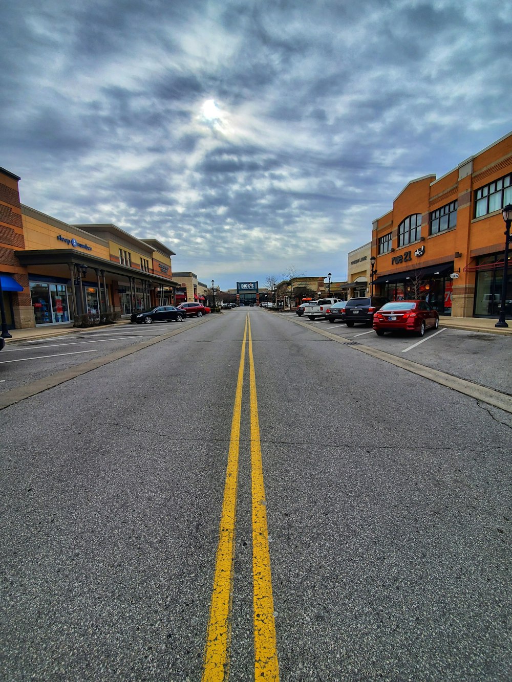 a street with cars parked along it