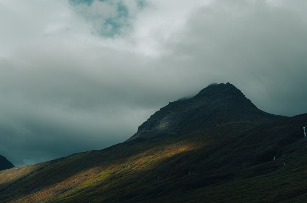 a mountain with a valley below