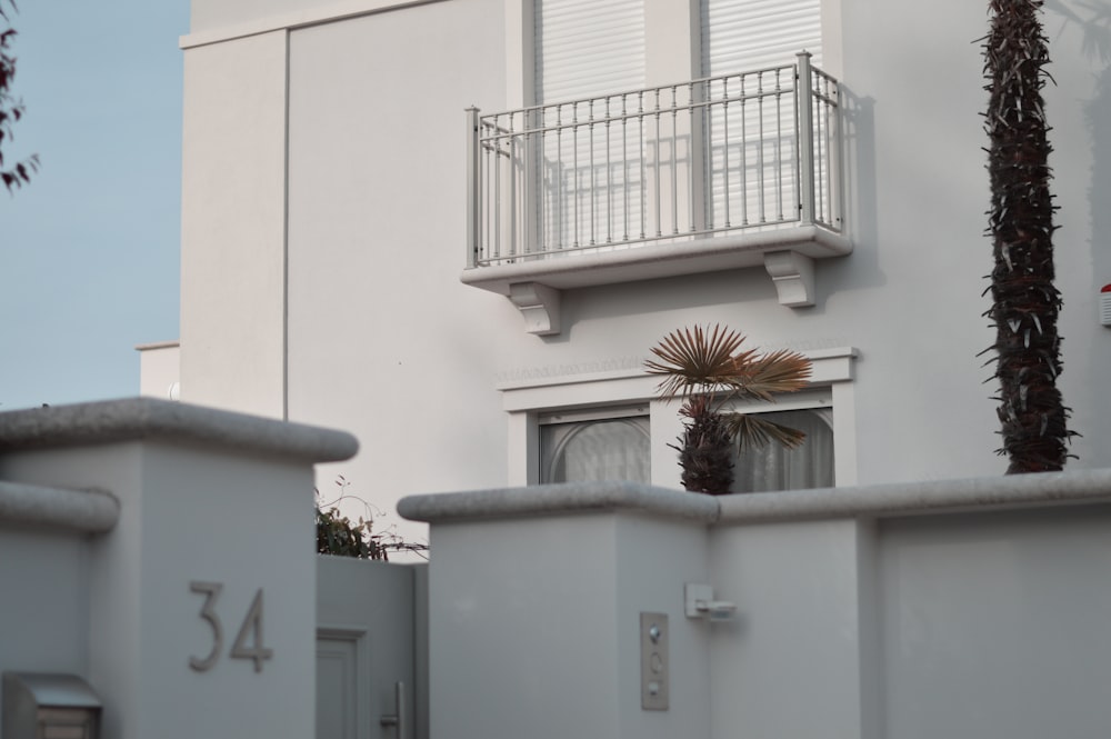 a white building with a balcony