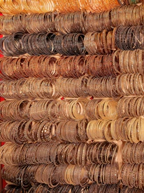 A vibrant showcase of metal bangles sparkling under soft lighting.