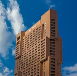 a tall building with a blue sky