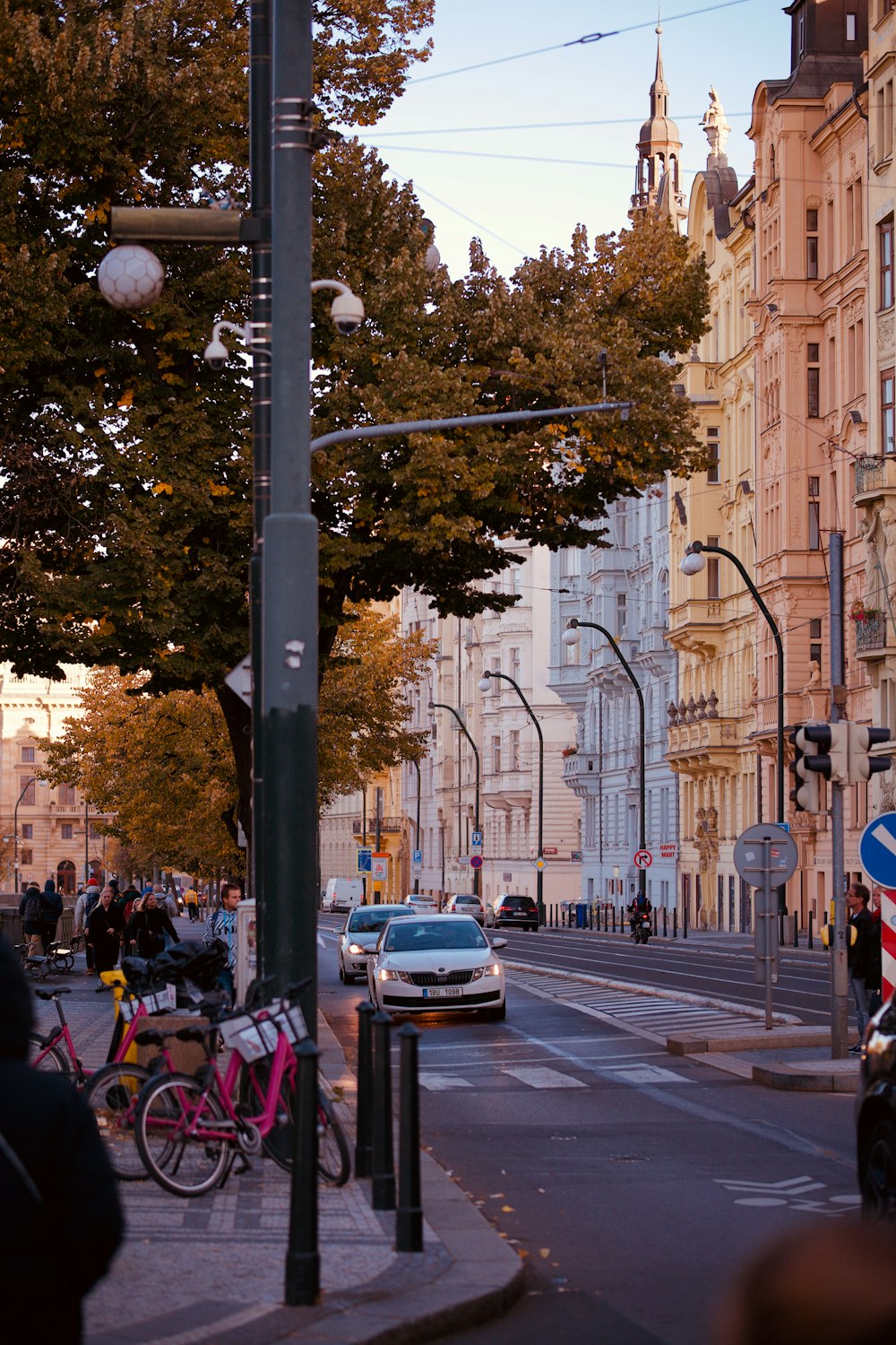 a city street with cars and bicycles