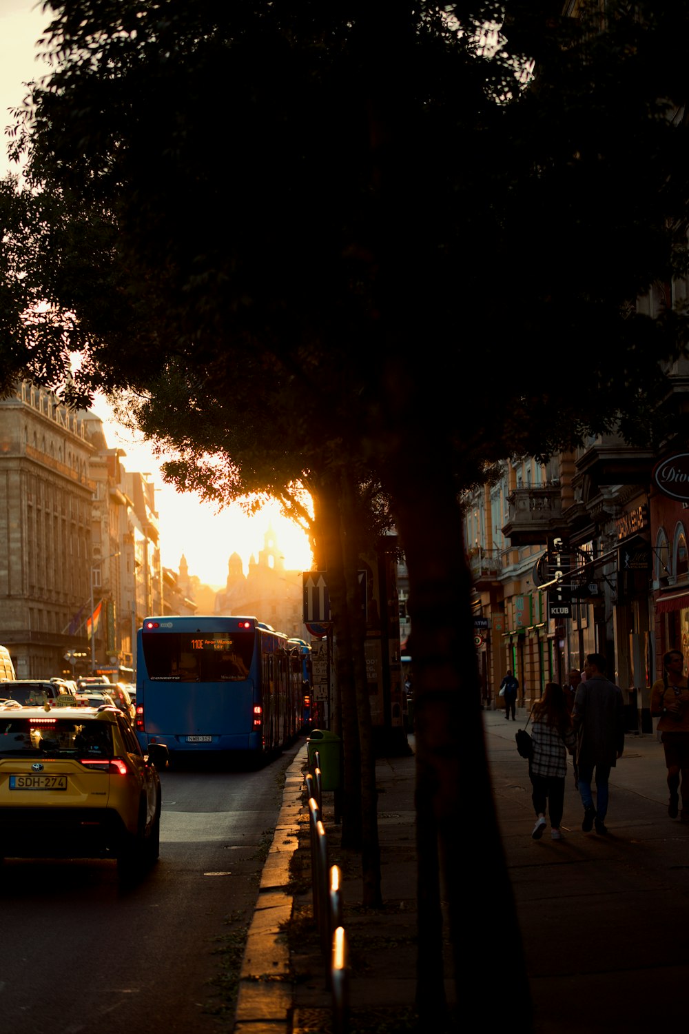 a bus and a car on a street