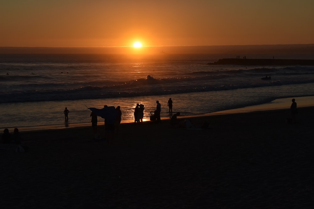 a group of people on a beach