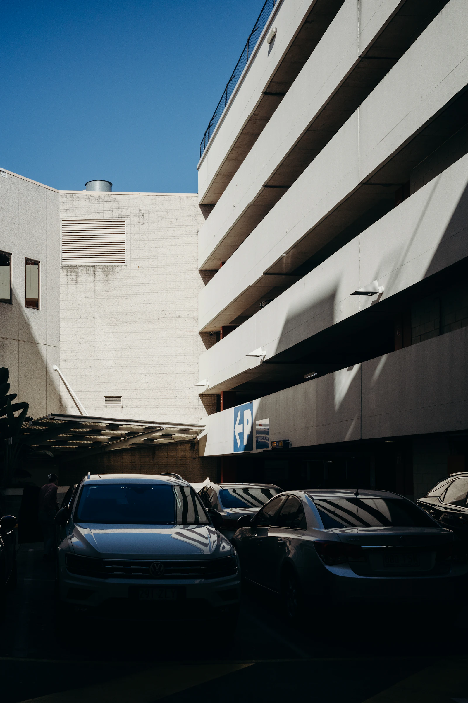 Cars are parked outside a Brisbane building