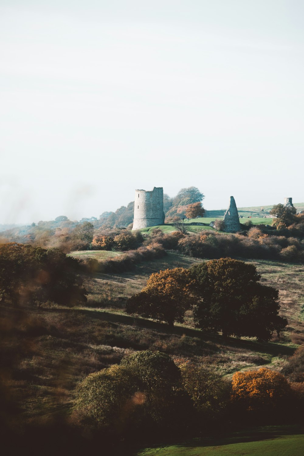 a stone structure in a field