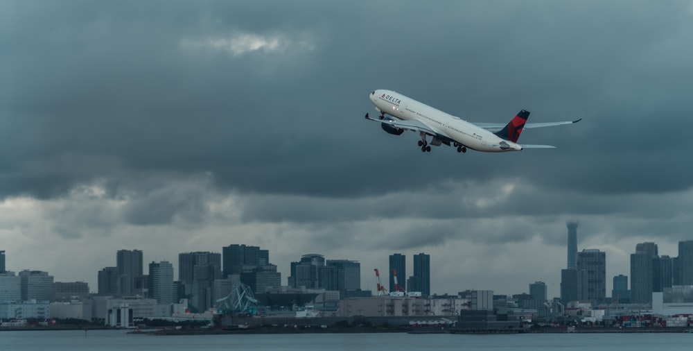 an airplane flying over a city