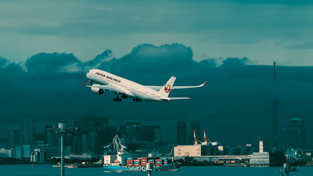 an airplane flying over a city