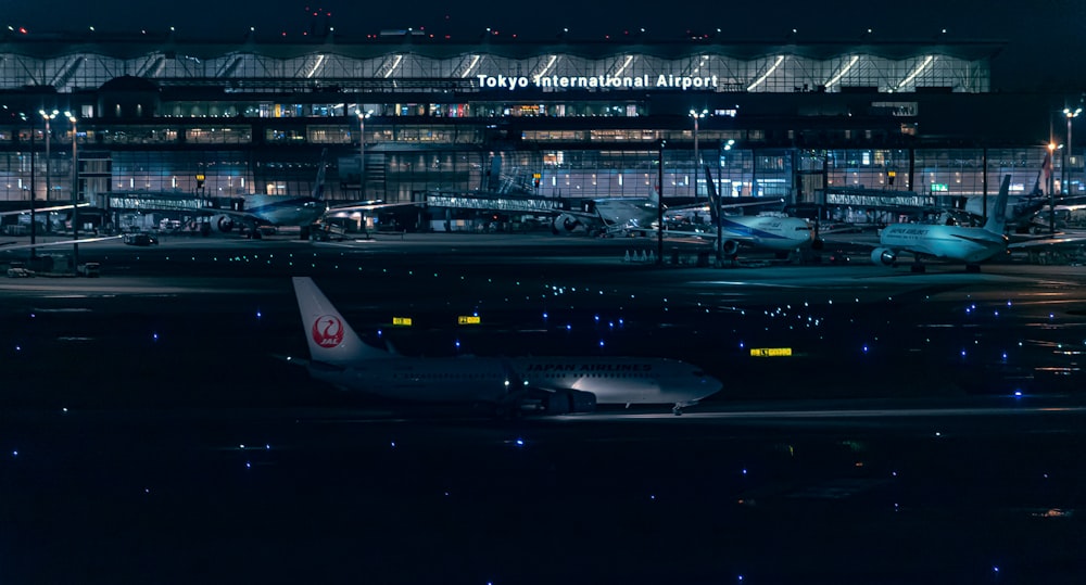 a large airport with airplanes